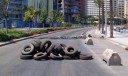 Remnants of a roadblock and burnt tyres