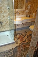 A hotel bathroom with everything - mosaics and all!